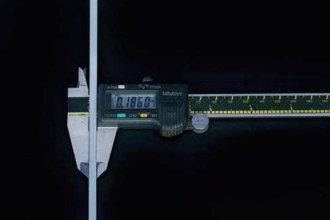A metal and steel measurement tool