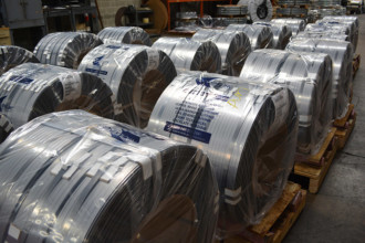 Oscillate wound wrapped stainless steel coils ready for shipment